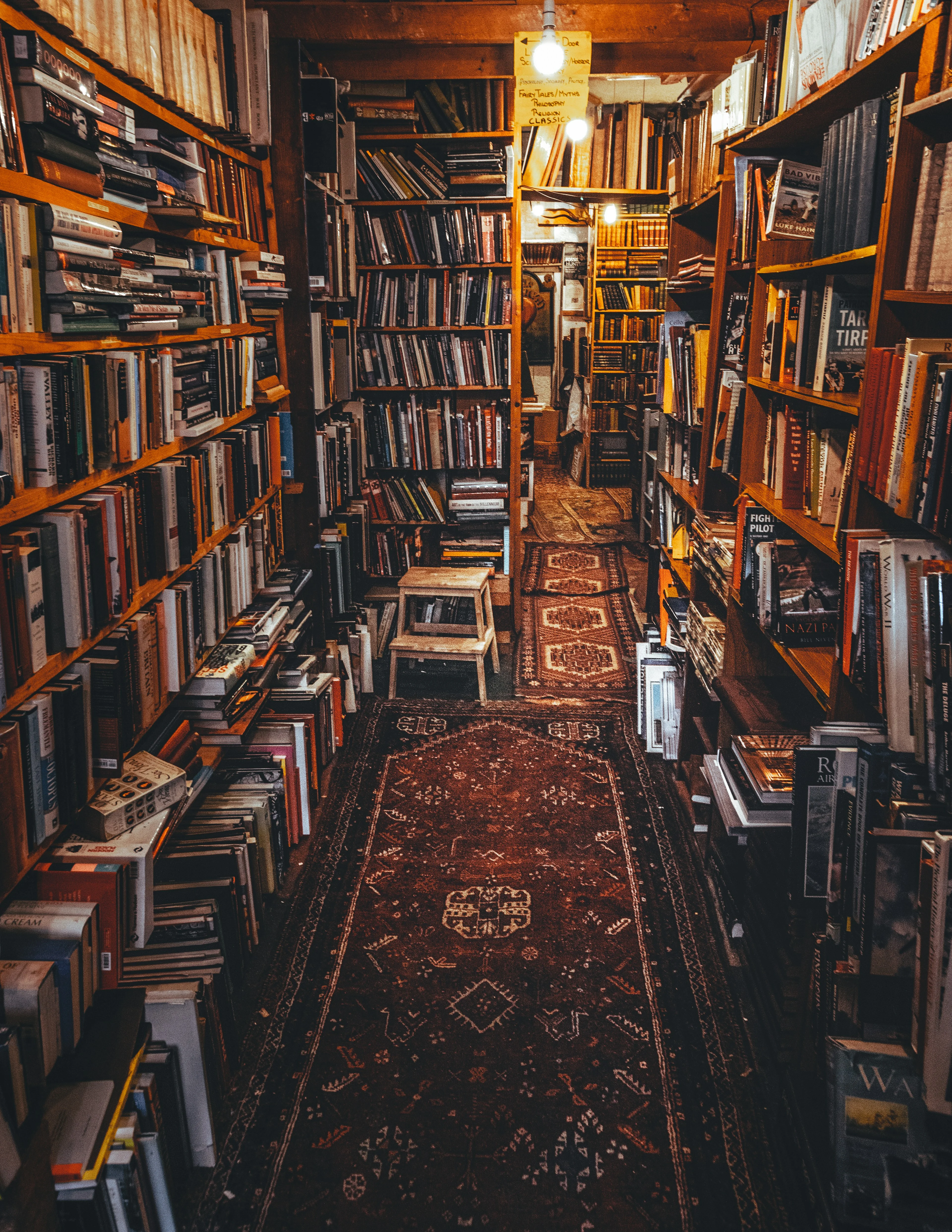 An inviting library filled with books and architectural detail.