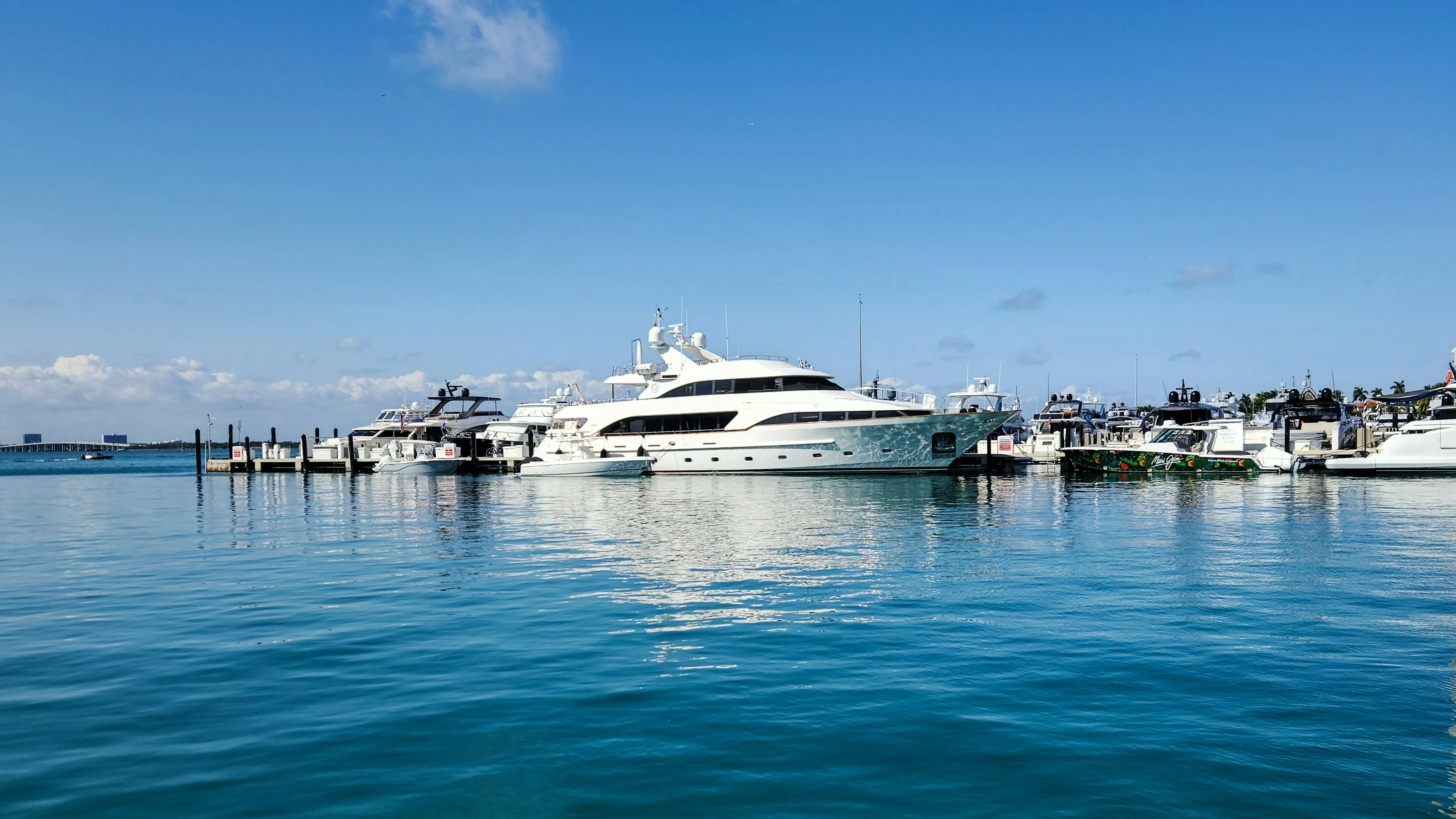 Boats moored beside a waterfront yacht club.